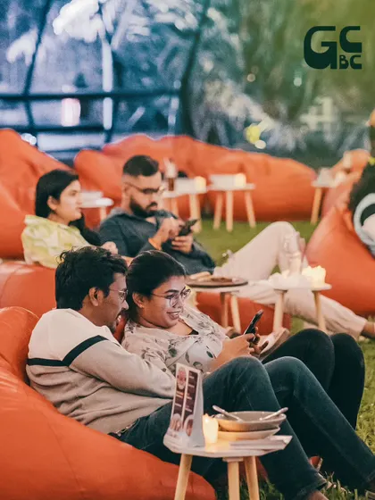 A couple relaxing on a beanbag during one of our outdoor events.