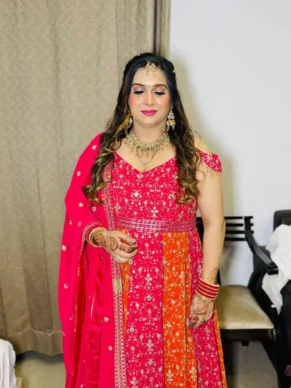 A full-length view of her vibrant outfit.