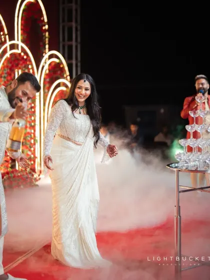 The couple's joy as they walk towards the champagne tower, a moment we meticulously planned.