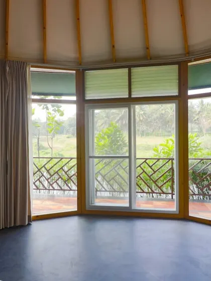 The panoramic window of our riverside cottage, bringing the beauty of the outdoors inside.