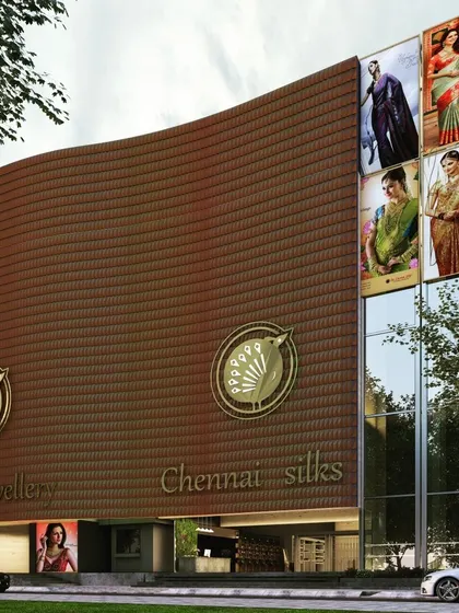 A concept render for The Chennai Silks flagship store, featuring a curved facade clad in a "metal drape" of terracotta-colored tiles. The design aims to create a modern landmark that reflects the brand's heritage.