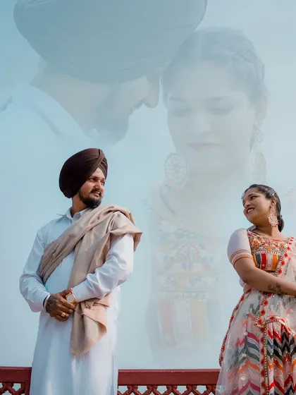 A creative double-exposure portrait of a Sikh couple, blending a candid moment with a soft, dreamy overlay, set against a classic Jaipur backdrop.