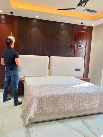 Final checks on this modern and warm bedroom design.
