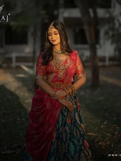 A beautiful portrait of a model in the multi-colored banarasi lehenga, radiating elegance and grace.