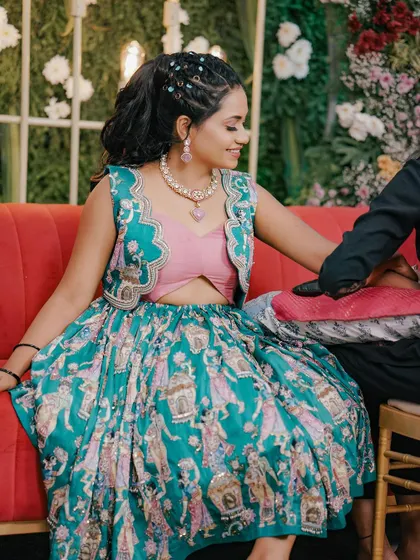 Getting my mehendi done in my custom-designed vibrant outfit.