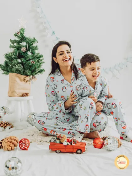 Cozy Christmas morning vibes with mom and son in matching pajamas. We create warm and joyful holiday sets perfect for creating your annual Christmas card photos.