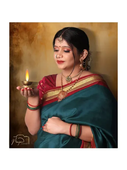 A close-up with a glowing diya, symbolizing light, hope, and divinity. A deeply spiritual and beautiful portrait.