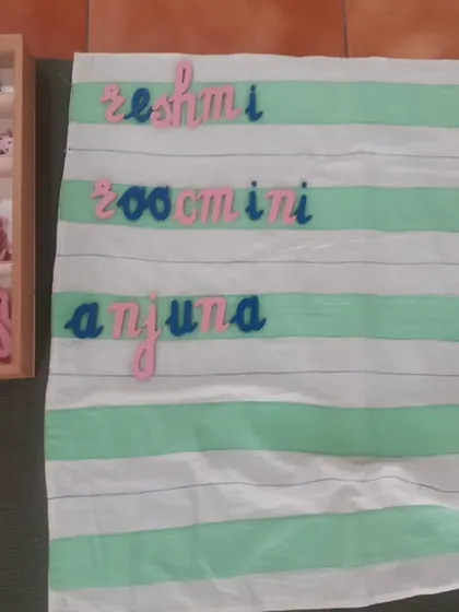 A close-up of the phonetic spelling of our teachers' names. This is a beautiful example of a child's emerging literacy skills.