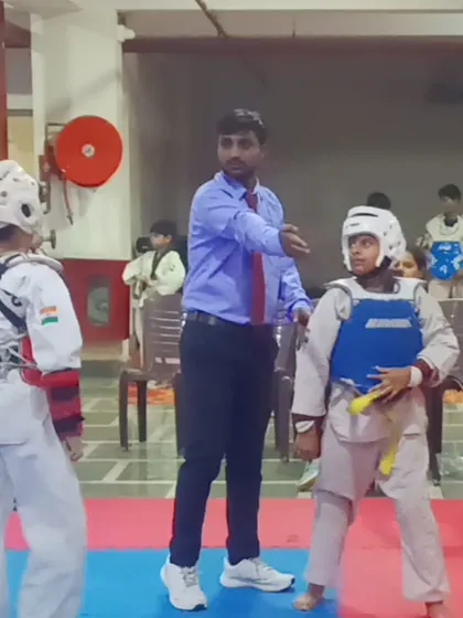 Guiding my young students during a match. My role is to give them the instructions and confidence they need to perform their best.