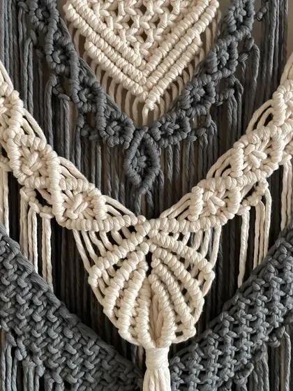 A close-up of the details on the grey and off-white tapestry. You can see the different types of knots I use to create layers and texture.