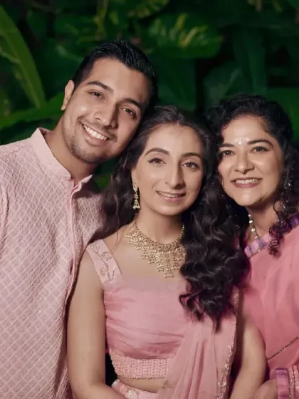 The bride with her mother and brother, a portrait of a happy and close-knit family.