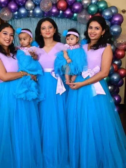 A fun group twinning moment. I created these matching lavender and blue gowns for the mothers and their babies for a birthday party.