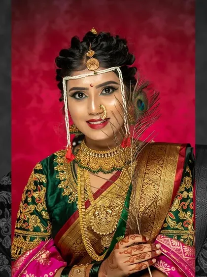 A stunning Maharashtrian bridal look created at my academy. The combination of the peacock feather, the traditional nath, and the radiant makeup makes for a picture perfect bride.