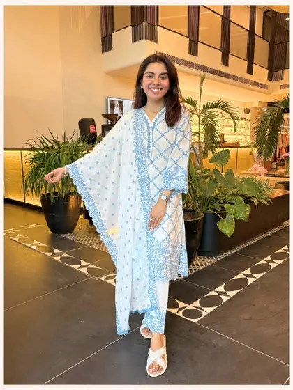 This white and blue printed kurta set is a classic. The geometric print and lace-trimmed dupatta create a look that is both traditional and modern.