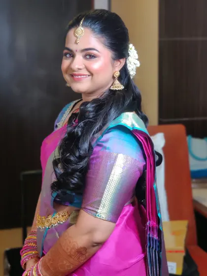 A happy and radiant Pavitra, ready for her engagement ceremony.