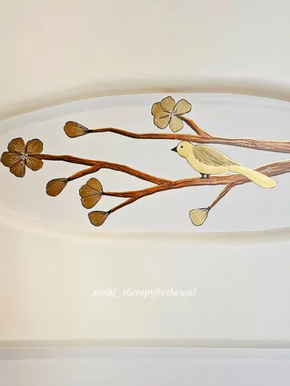 Detail of a single bird among golden blossoms. This minimalist approach is perfect for adding an artistic touch without overwhelming a space.