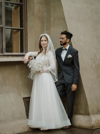 A classic portrait of the couple, with the groom looking lovingly at his bride. Her serene expression and his gentle gaze tell a story of deep connection.