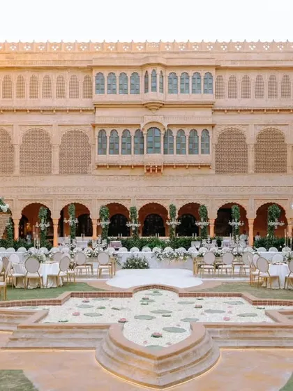 At Suryagarh, Jaisalmer, timeless elegance meets royal splendor. This image shows a beautiful daytime setup in the palace courtyard, where we blend regal architecture with our bespoke decor to create a majestic reality.