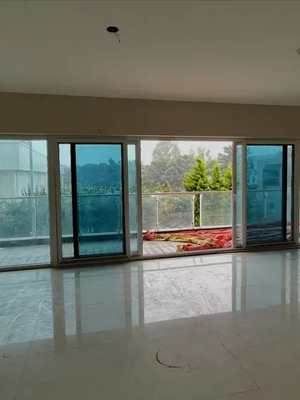 A bare living room during the initial stages of a project. This is the starting point from which we build your dream home.