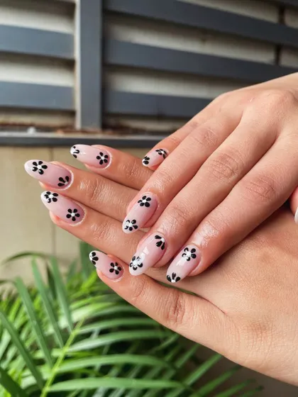 Another angle of our popular minimalist floral design. The contrast between the black flowers and the sheer nude base makes this a versatile and modern choice for any occasion.