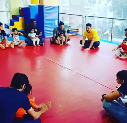 A collection of joyful moments from a Saturday evening "Super Beasts" class, featuring bubble time, group activities, and lots of smiles between parents and children.