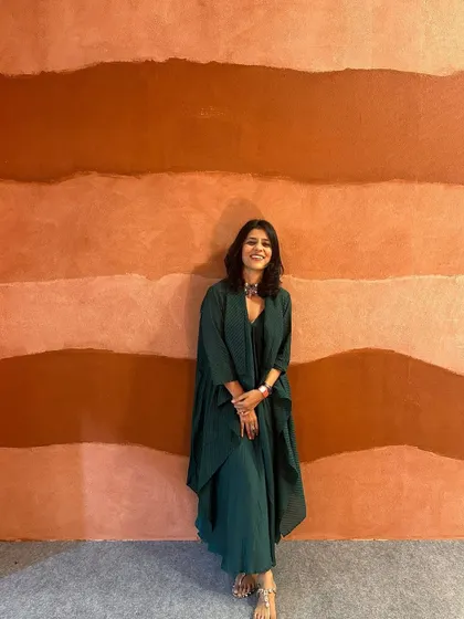 A full-length view of my simple yet elegant green cotton dress. The layered design adds a touch of sophistication to this comfortable outfit.