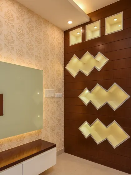 A closer look at the backlit decorative partition and TV unit. This feature not only separates spaces but also serves as a unique lighting element and art piece in the living room.