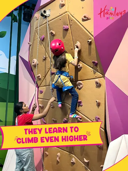 Look at that focus! Rock climbing is a fantastic activity that improves problem-solving skills and physical strength, all while being incredibly fun.
