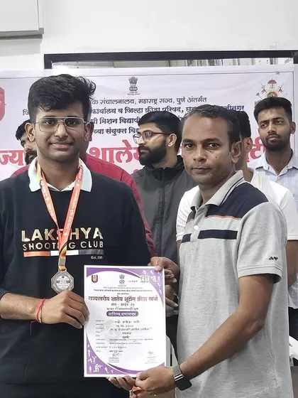 A proud moment for another one of my students, receiving his silver medal at the Interschool State Tournament. His smile reflects the satisfaction of hard-earned success.