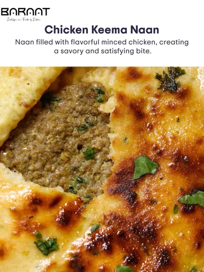 A close-up of the rich, spiced chicken keema filling inside our soft, freshly baked naan.