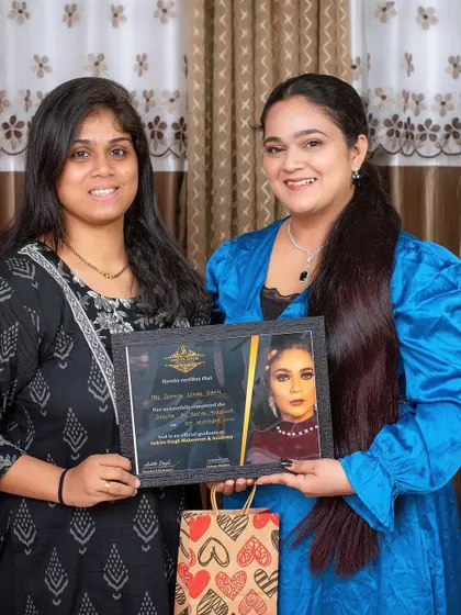 Another proud graduate from my academy. Each student receives a certificate of completion, validating their training in professional makeup and hairstyling.