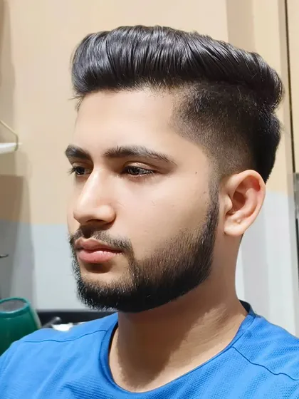 The final look. A perfectly executed haircut and beard style for a modern, polished appearance.