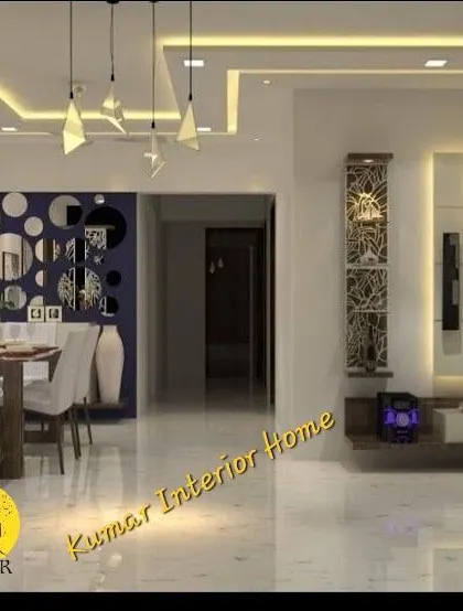 A view of a living and dining area that showcases our use of decorative elements. The circular mirror arrangement on the accent wall adds an artistic touch, complementing the modern furniture and lighting.