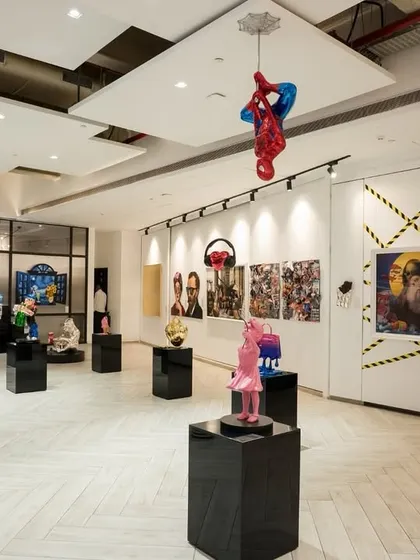 The thoughtful curation of our gallery floor ensures a balance between statement pieces and negative space. This view shows how we arrange artworks to create visual harmony and encourage unhurried appreciation from our visitors.