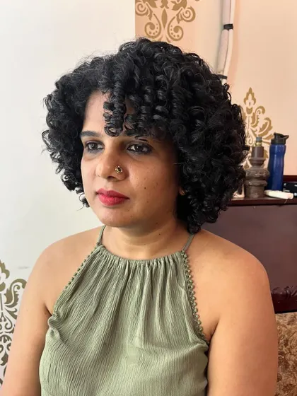 The final result is a beautiful, healthy-looking curly bob that's easy to style.