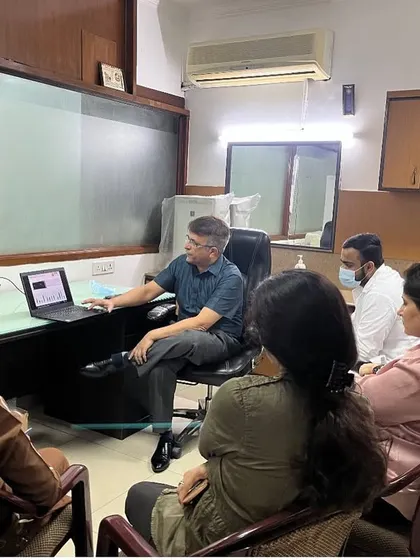 An intimate group of doctors engaged in a discussion about filler techniques at my clinic. These small sessions allow for deep dives into specific topics and personalized feedback.