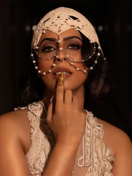 For a Vogue India event, we created a dramatic and artistic look. The focus was on a bold, smokey eye that complemented the intricate headpiece and avant-garde outfit, perfect for a high-fashion setting.