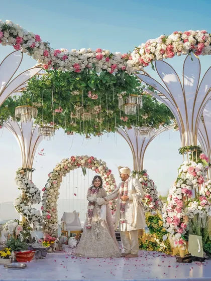We obsess over the details that make a wedding truly yours. This breathtaking floral mandap was designed to feel like a natural extension of the sky, creating an ethereal space for Dhwani and Harshit to say their vows.