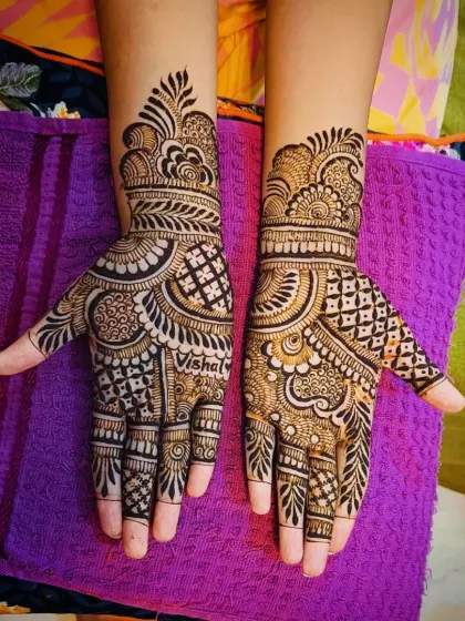 A top-down view of the 'Vishal' mehandi, showing the complete palm design.