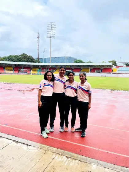 Our players standing on the athletics track at the stadium in Pune. This program provides them with a deeper understanding of the rules and management of hockey.
