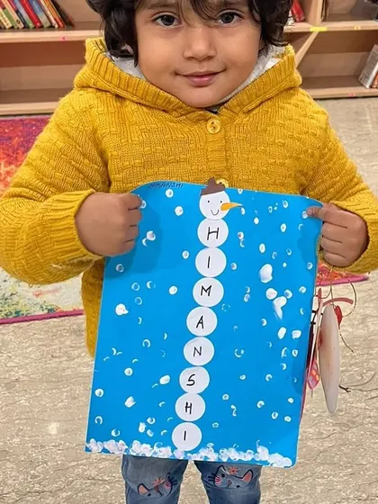 Another adorable snowman craft from our winter camp. Personalizing the art makes it extra special for each child.