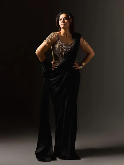 This look for Kajol in the film 'Maa' was inspired by the fierce energy of Goddess Kali. We collaborated with designer Torani to create a custom black saree with a fluid, untamed drape, paired with a gold corset blouse that acts as modern armor. It’s a powerful statement on divine feminine strength, designed to be both beautiful and intimidating.