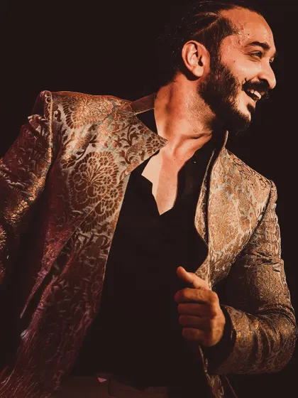 A candid, smiling moment captured on stage during a performance.