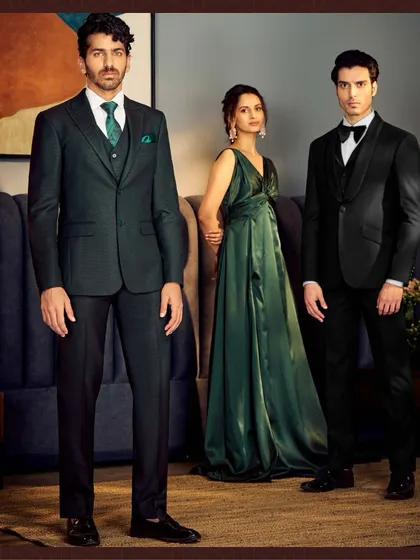 Customization is the ultimate luxury. Here we showcase two Italian silhouettes, a dark green three-piece suit and a classic black tuxedo, both crafted from fine fabrics.
