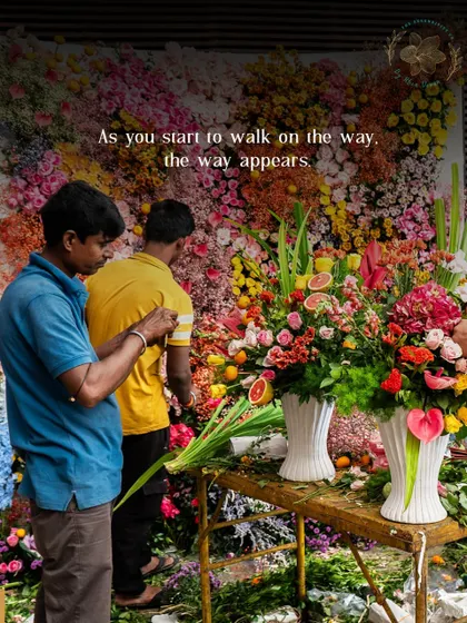 "As you start to walk on the way, the way appears." This image of my team creating a floral wall embodies the process of bringing a vision to life, one step at a time.