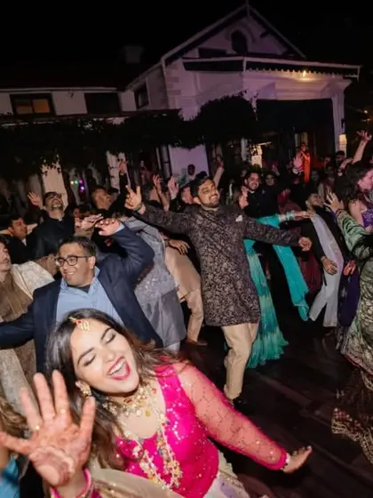 Another shot of the lively dance floor, filled with guests who are all smiles, enjoying the fantastic music and atmosphere.