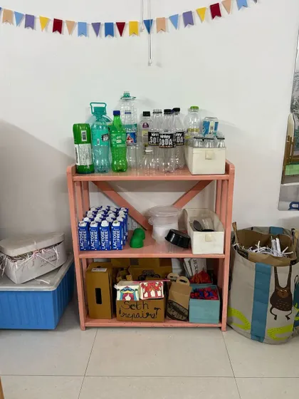 Welcome to the Playmaker’s Lab, our end-of-year tradition where we replace toys with recycled treasures. This shelf, stocked with bottles, cartons, and paper, is a treasure trove for the imagination, inviting children to see endless play possibilities in ordinary, everyday materials.