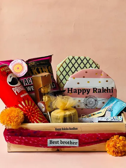 A wooden tray hamper for Rakhi, featuring uniquely shaped gift boxes and a "Best brother" tag.