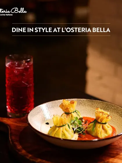 Dine in style at L'Osteria Bella. This image showcases an elegantly presented dish of pasta dumplings, highlighting the sophisticated and authentic Italian cuisine perfect for a romantic dinner.