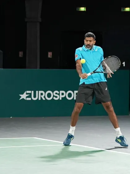 A low forehand shot, requiring balance and precision.